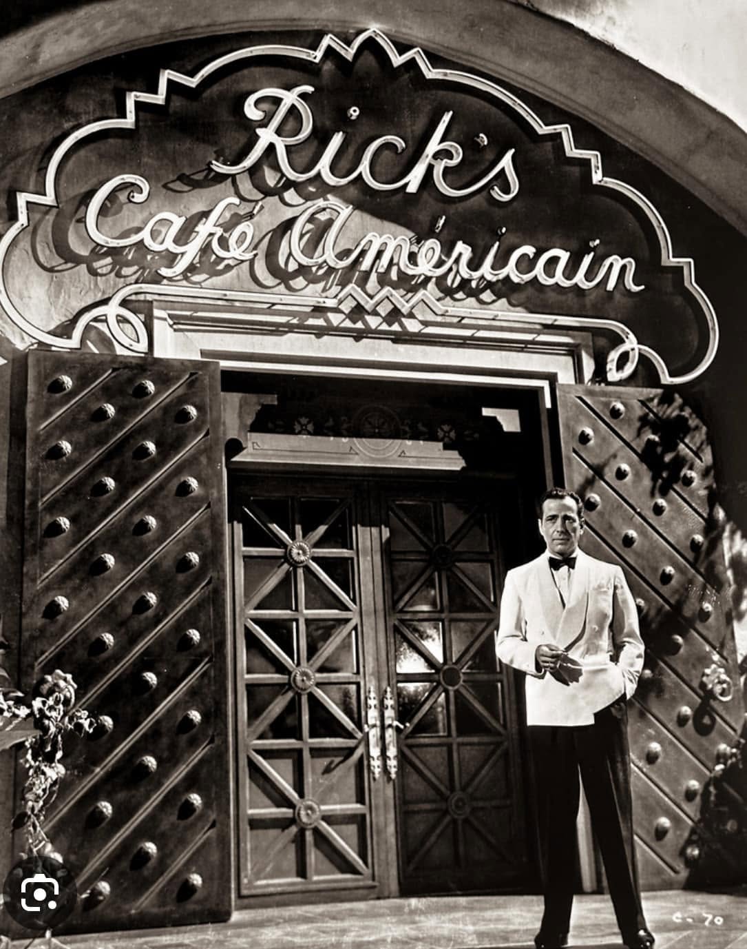 man in front of a cafe